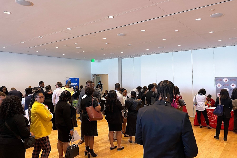 Job seekers in a line waiting to speak with DC government staff.