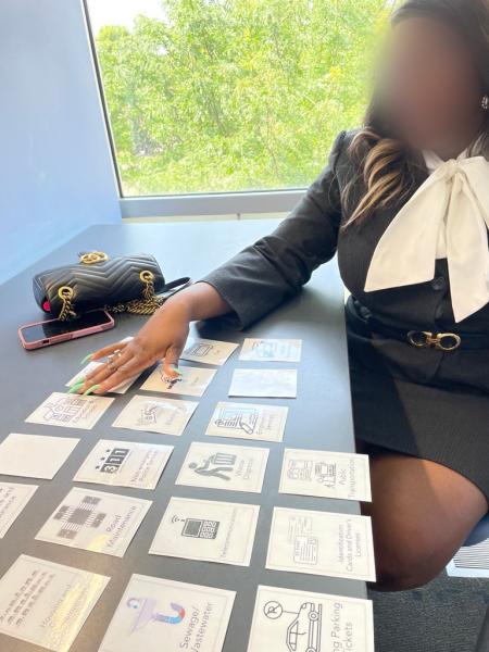 A resident interacting with cards with pictograms on them