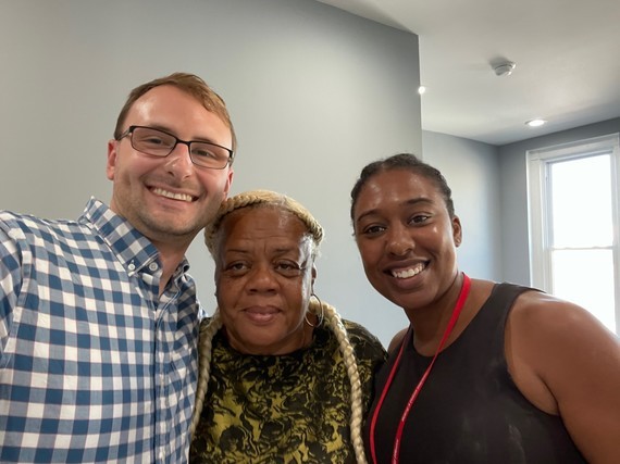 Matt Gerken (left) and Dr. Lindsay Quarles (right) meet with Ms. Wanda Henderson (middle), a DC small business owner
